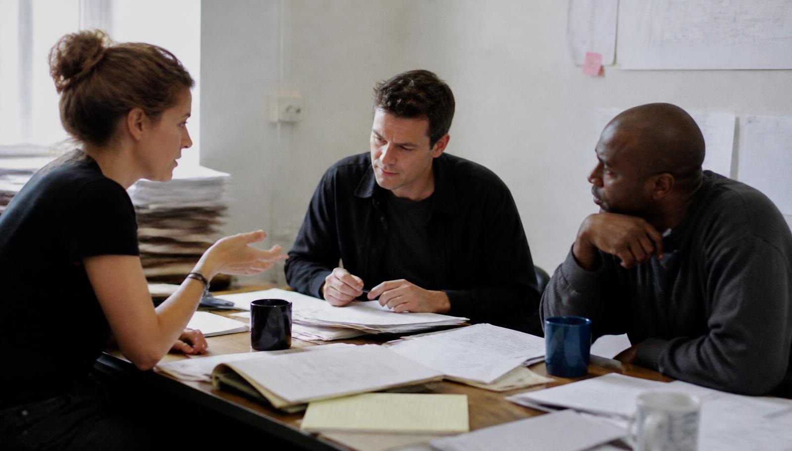 A team working together in a bright meeting room